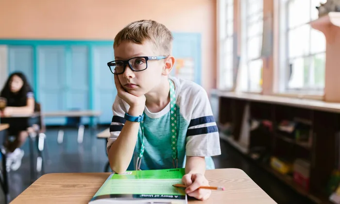 Child with ADHD distracted in classroom