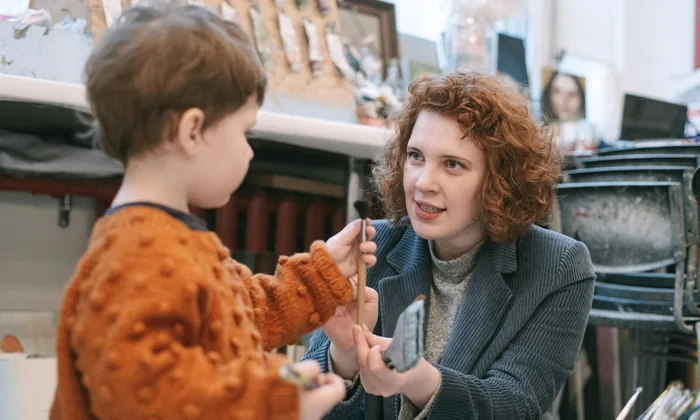 Adult working with child with autism