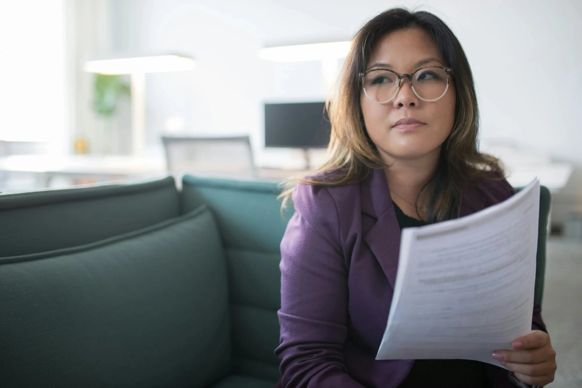 Parent reading an official school document at a desk — representing the Prior Written Notice right in special education